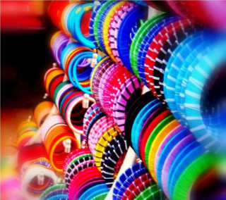 Colorful frisbees stacked table row - a row free wallpaper