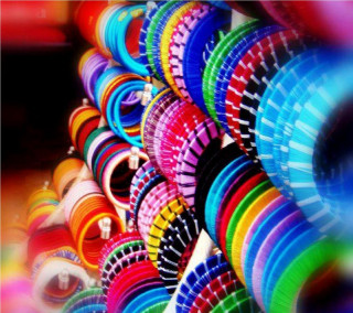 Colorful frisbees stacked row table - a row free wallpaper