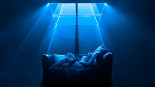 Woman couch blue light room - a blue light free wallpaper