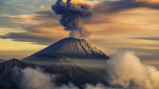 Mountain smoke plume clouds sky - a microscopic photo free wallpaper