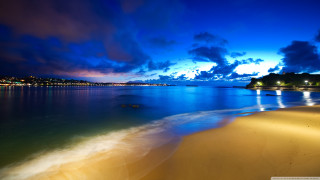 Beach water city night clouds - mystical free wallpaper