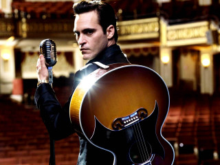 Man holding guitar microphone theatre - his hand and a microphone free wallpaper