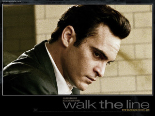 Man suit tie serious expression - poster free wallpaper