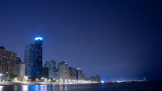 City skyline night water tall 2 - a blue light free wallpaper