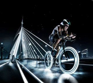 Man riding bike city night - arie smit free wallpaper