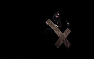 Woman black dress holding cross - free dark wallpaper