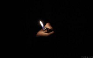 Person holding lighter dark background - a lighter free wallpaper
