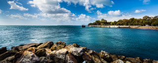 Water rocks dock cloudy sky - a cloudy sky above free wallpaper