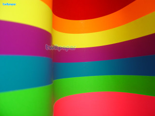 Rainbow colored wall clock side - side and a clock free wallpaper