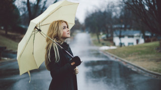 Woman holding umbrella rainy day - rainy free wallpaper
