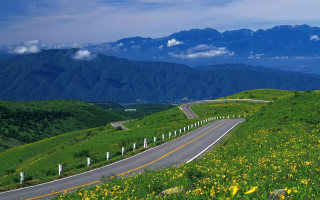 Winding road green hillside mountains 2 - the side of the road free wallpaper