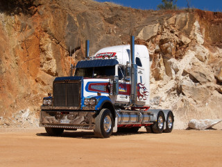 Semi truck rocky cliff mountain - a semi truck free wallpaper