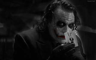 Joker man serious card holding - derek chittock free wallpaper