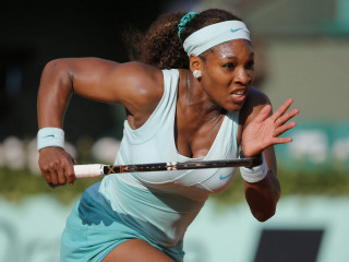 Woman swinging tennis racquet court - a ball free wallpaper