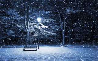 Bench snowy park night streetlight 4 - a street light in the background free wallpaper