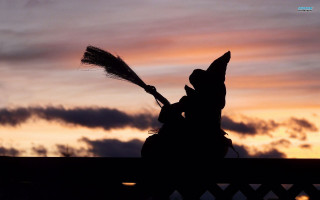 Witch silhouette broom sunset sky - a sunset sky free wallpaper