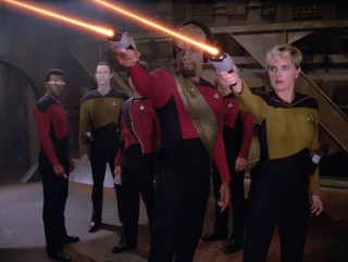Star trek uniforms group holding - one man free wallpaper