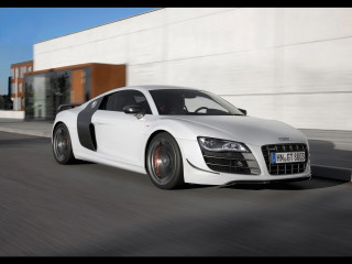White car driving street building - a black stripe free wallpaper