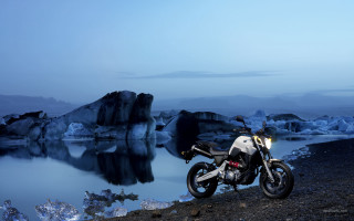 Motorcycle rocky shore water icebergs - bernt tunold free wallpaper