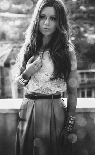 Woman balcony serious look camera - a balcony free wallpaper