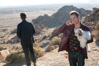 Man talking cellphone holding dog - movie still free wallpaper