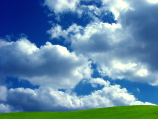 Green hill blue sky clouds 2 - a green field below free wallpaper