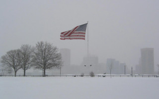 Snowy city park flag wind - tall building free wallpaper