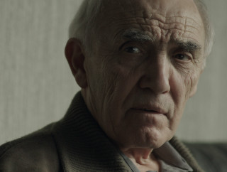 Old man serious look shoulders - his face free wallpaper