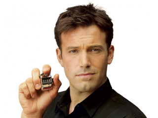 Man holding small bottles cologne - feature free wallpaper
