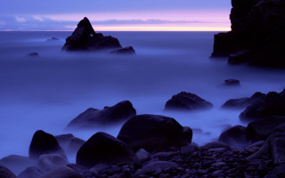 Rocky beach purple sky clouds 2 - the water free wallpaper