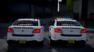 Two white police cars nighttime - rim free wallpaper