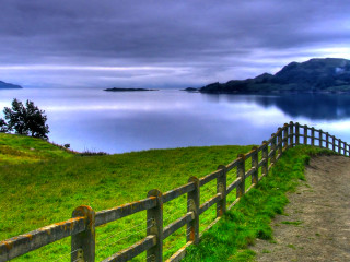 Wooden fence grassy hill lake - a wooden fence free wallpaper