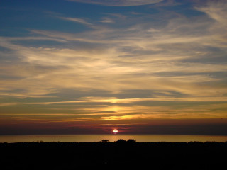 Sunset clouds trees foreground water 3 - free sunset wallpaper