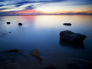 Sunset water rocks sky clouds 3 - the water free wallpaper