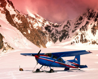 Blue airplane snowy mountain beach - top of a snow free wallpaper