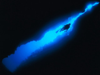 Man swimming blue light black - the water free wallpaper