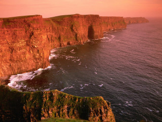 Cliff water cityscape sunset reflection - a cliff face free wallpaper