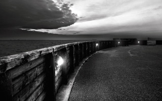 Long wooden pier lights dark - a dark sky above free wallpaper