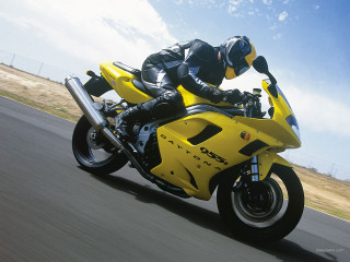 Man riding yellow motorcycle street - a man riding free wallpaper