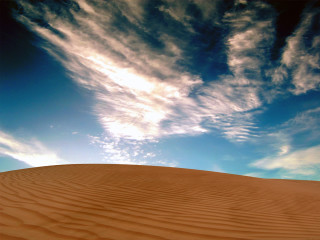 Sand dune blue sky bench - a large sand dune free wallpaper