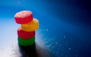 Colorful candies stack table blue 2 - top of a table next free wallpaper