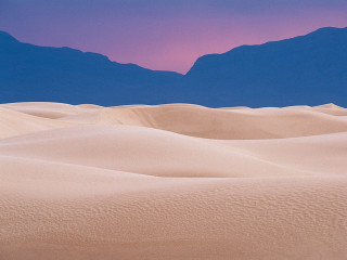 Desert mountain range pink sky 5 - a mountain range in the distance free wallpaper
