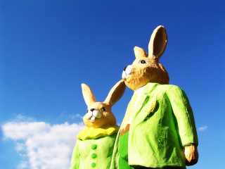 Rabbit statues green outfits sunny - naive free wallpaper