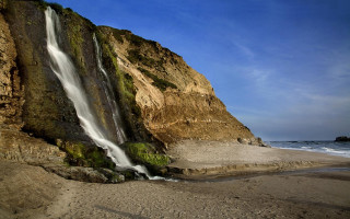 Waterfall cliff ocean sunny day - blue sky free wallpaper