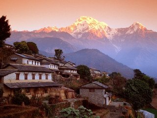Mountain range houses snow capped - mountain in the background free wallpaper