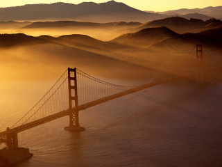 Foggy bridge mountains golden sky - golden free wallpaper