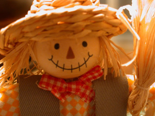 Scarecrow doll strawhat redbow tie - evaline ness free wallpaper