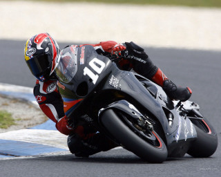 Motorcycle curve leaning person helmet - a motorcycle free wallpaper