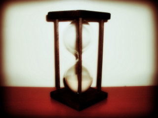 Hourglass sandglass table whitewall redfloor - a white wall free wallpaper