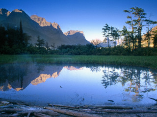 Lake mountains trees logs foreground - douglas robertson bisset free wallpaper